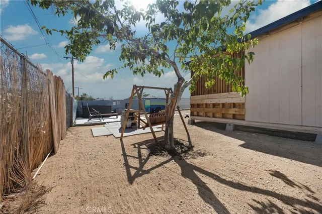 a view of a backyard with a patio