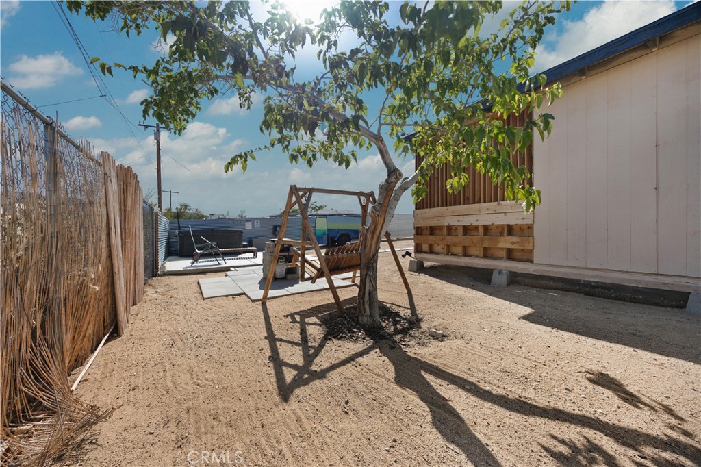 6123 Scenic Drive Joshua Tree, CA 92252 - Photo 25 of 30 a view of a backyard with a patio