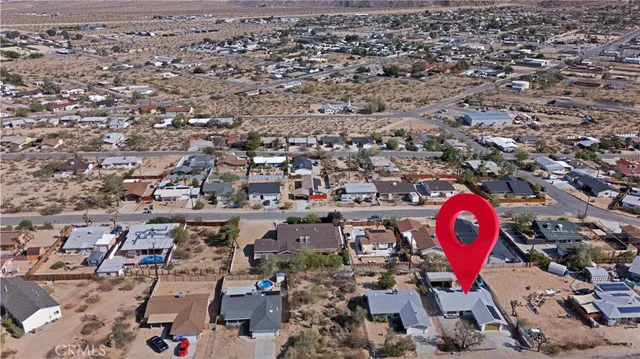 an aerial view of a parking space with city view