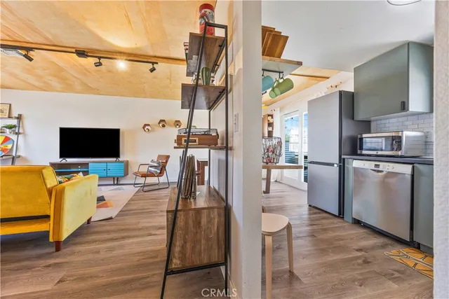a view of a living room and a flat screen tv