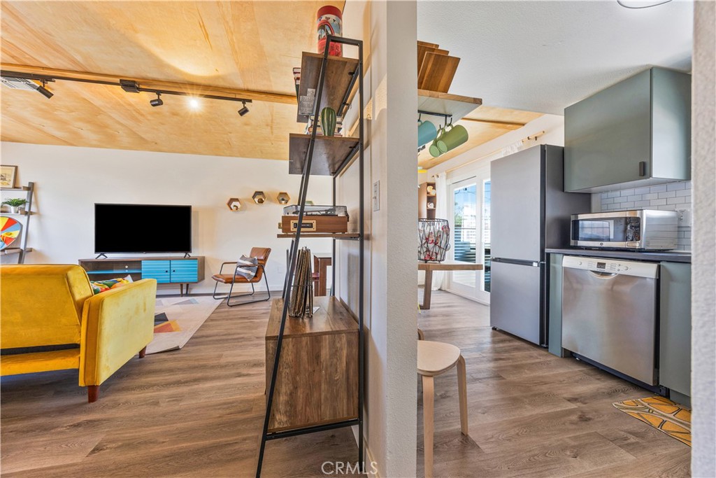 6123 Scenic Drive Joshua Tree, CA 92252 - Photo 7 of 30 a view of a living room and a flat screen tv