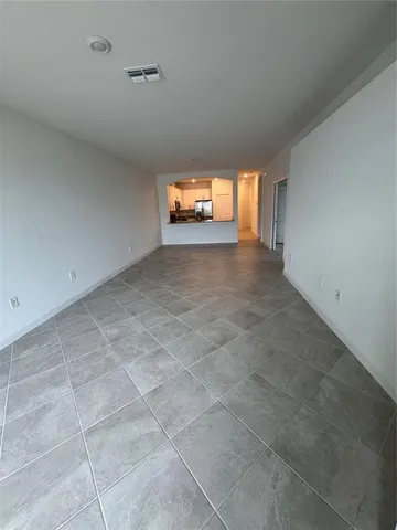 a view of empty room with windows