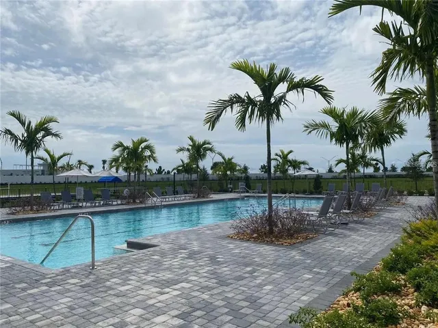 a view of a lake with a palm trees