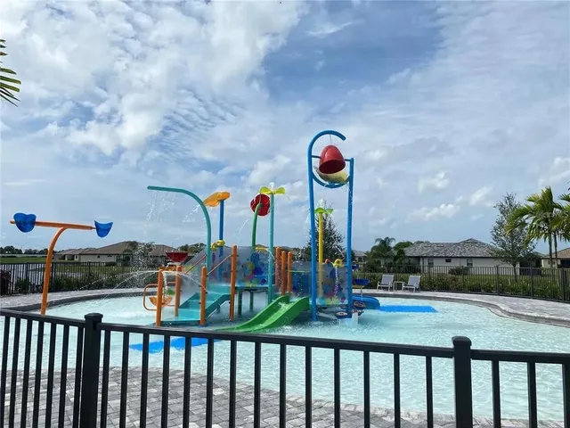 a view of a street with a cars parked