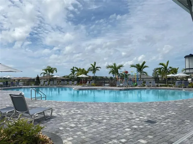 a view of a lake with houses in the back