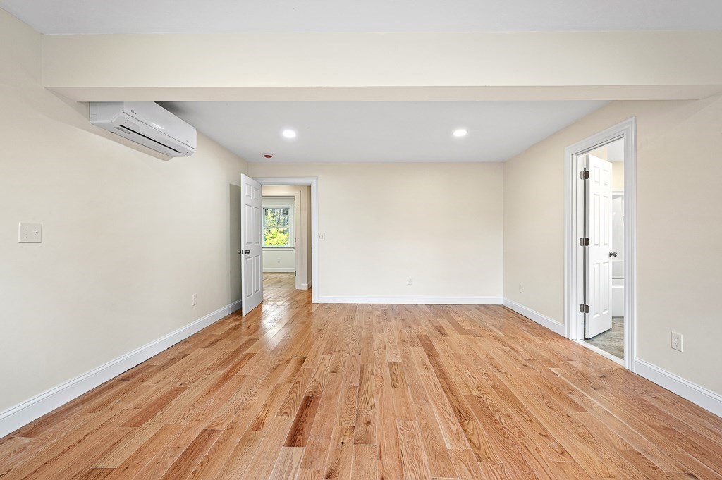 10 Beale Street Worcester, MA 01606 - Photo 17 of 42 a view of an empty room with wooden floor