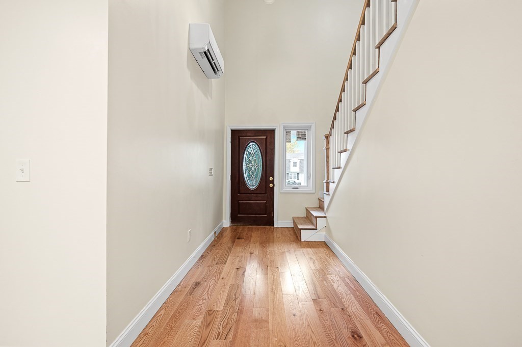 10 Beale Street Worcester, MA 01606 - Photo 6 of 42 a view of a hallway with wooden floor and entryway
