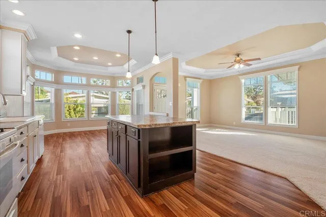 a view of kitchen with wooden floor and windows