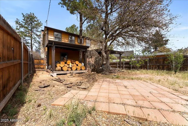 a view of a backyard with a snow on the road