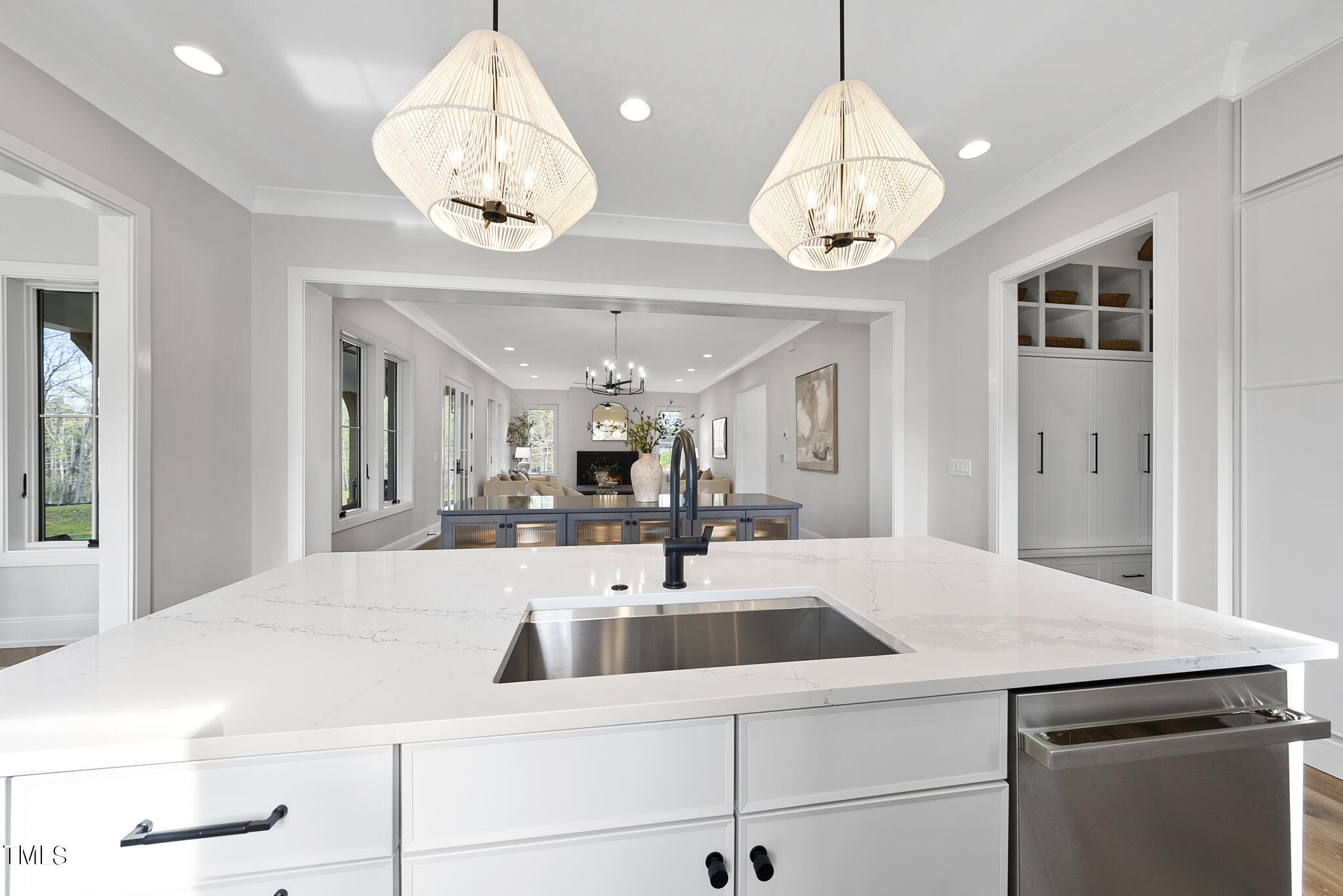 3409 Makers Circle Raleigh, NC 27612 - Photo 16 of 100 a kitchen with a sink a chandelier and living room view