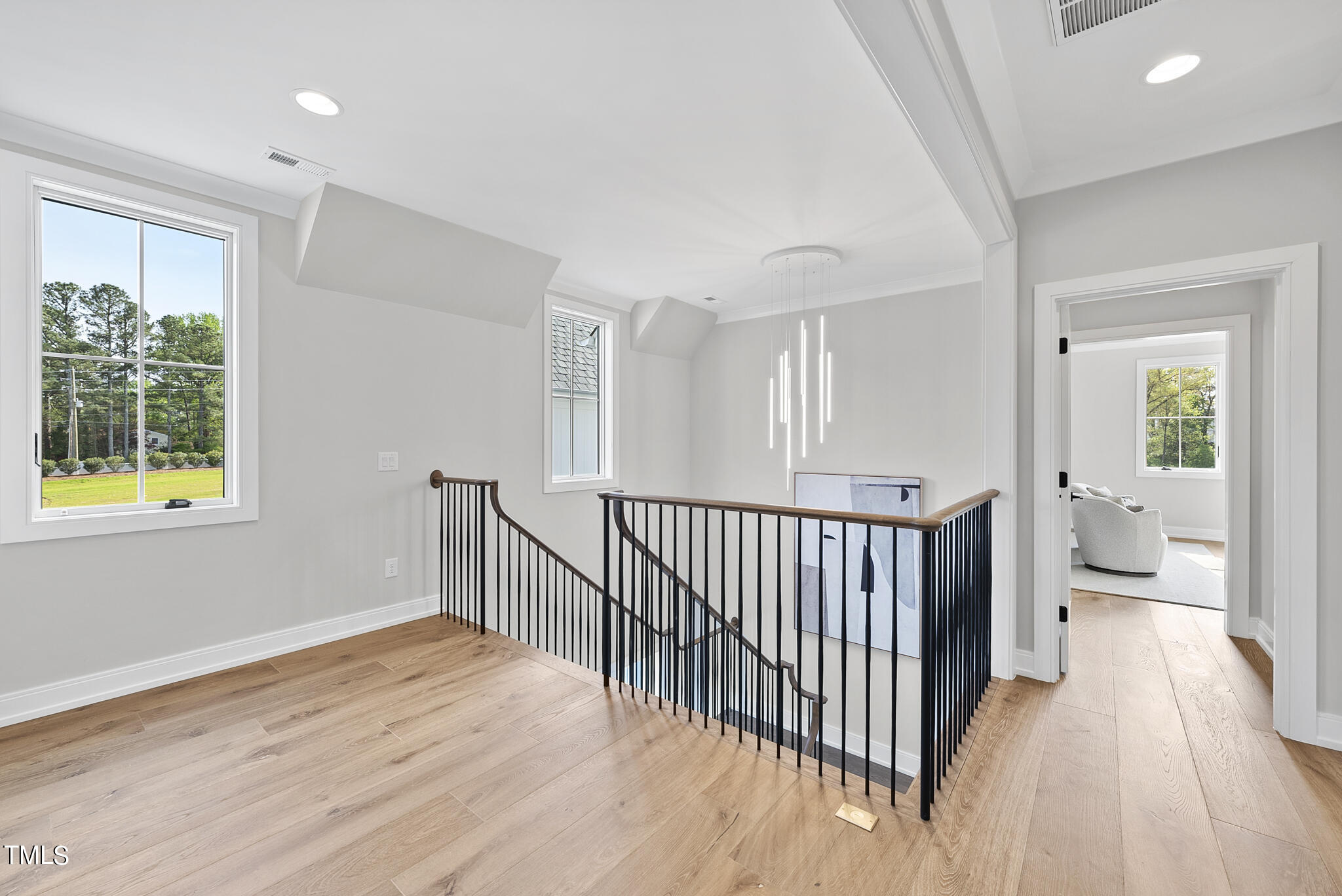 3409 Makers Circle Raleigh, NC 27612 - Photo 40 of 100 a view of a room with wooden floor and windows