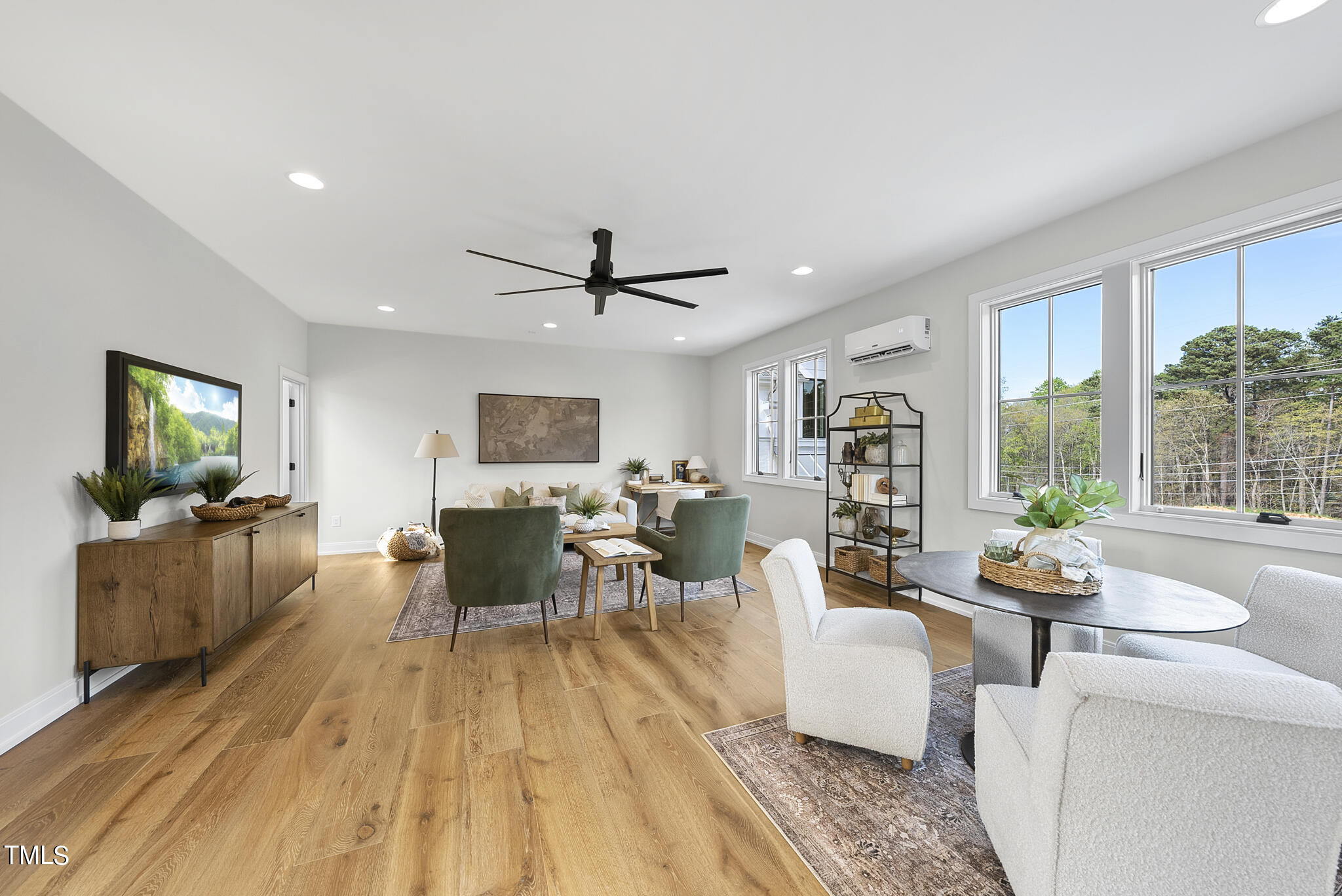 3409 Makers Circle Raleigh, NC 27612 - Photo 42 of 100 a living room with furniture and a flat screen tv
