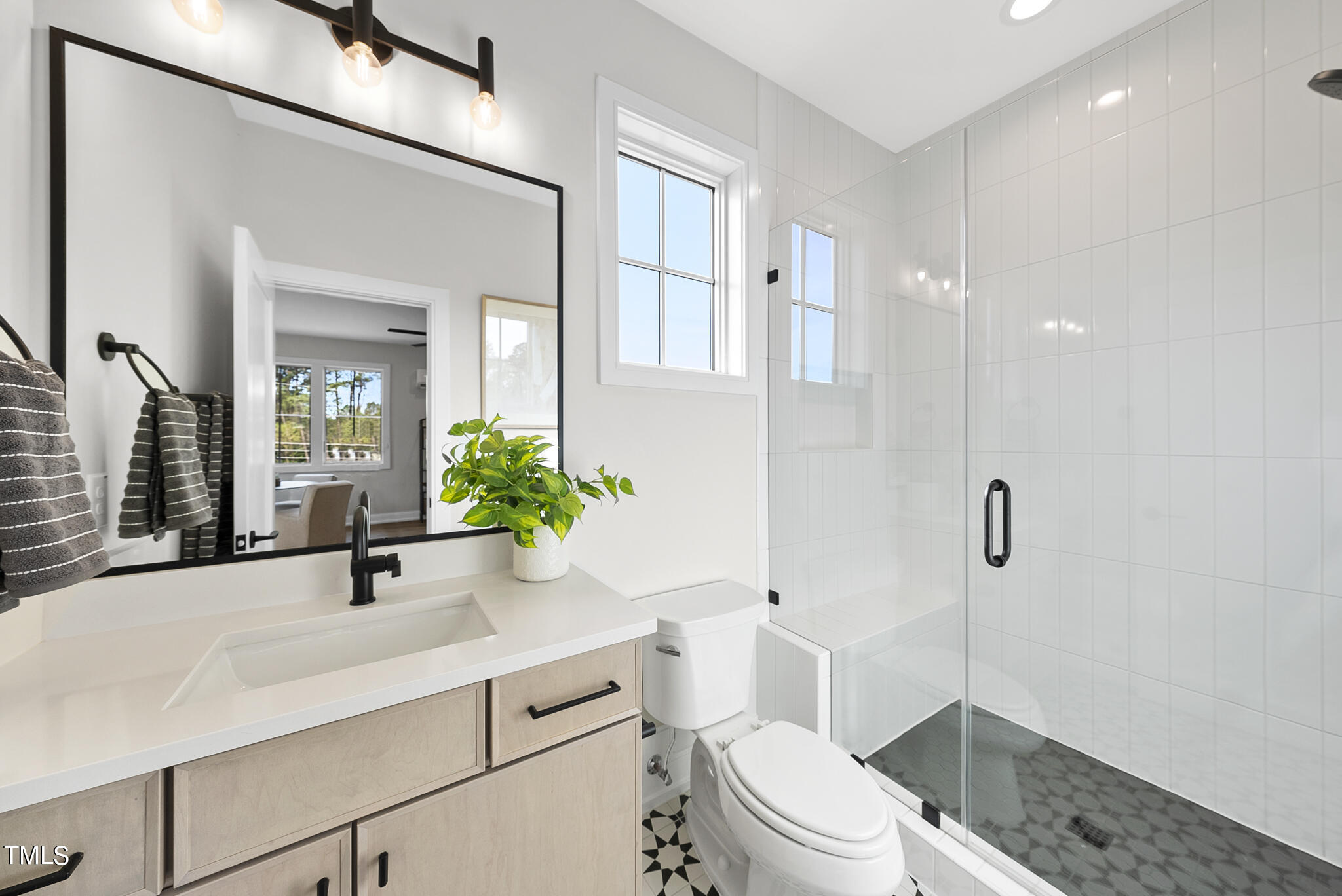 3409 Makers Circle Raleigh, NC 27612 - Photo 45 of 100 a bathroom with a sink a toilet and shower