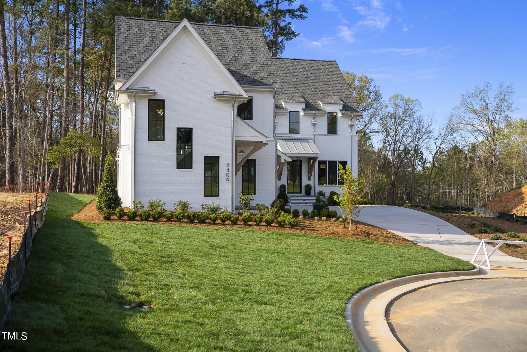 3409 Makers Circle Raleigh, NC 27612 - Photo 57 of 100 a front view of a house with a yard
