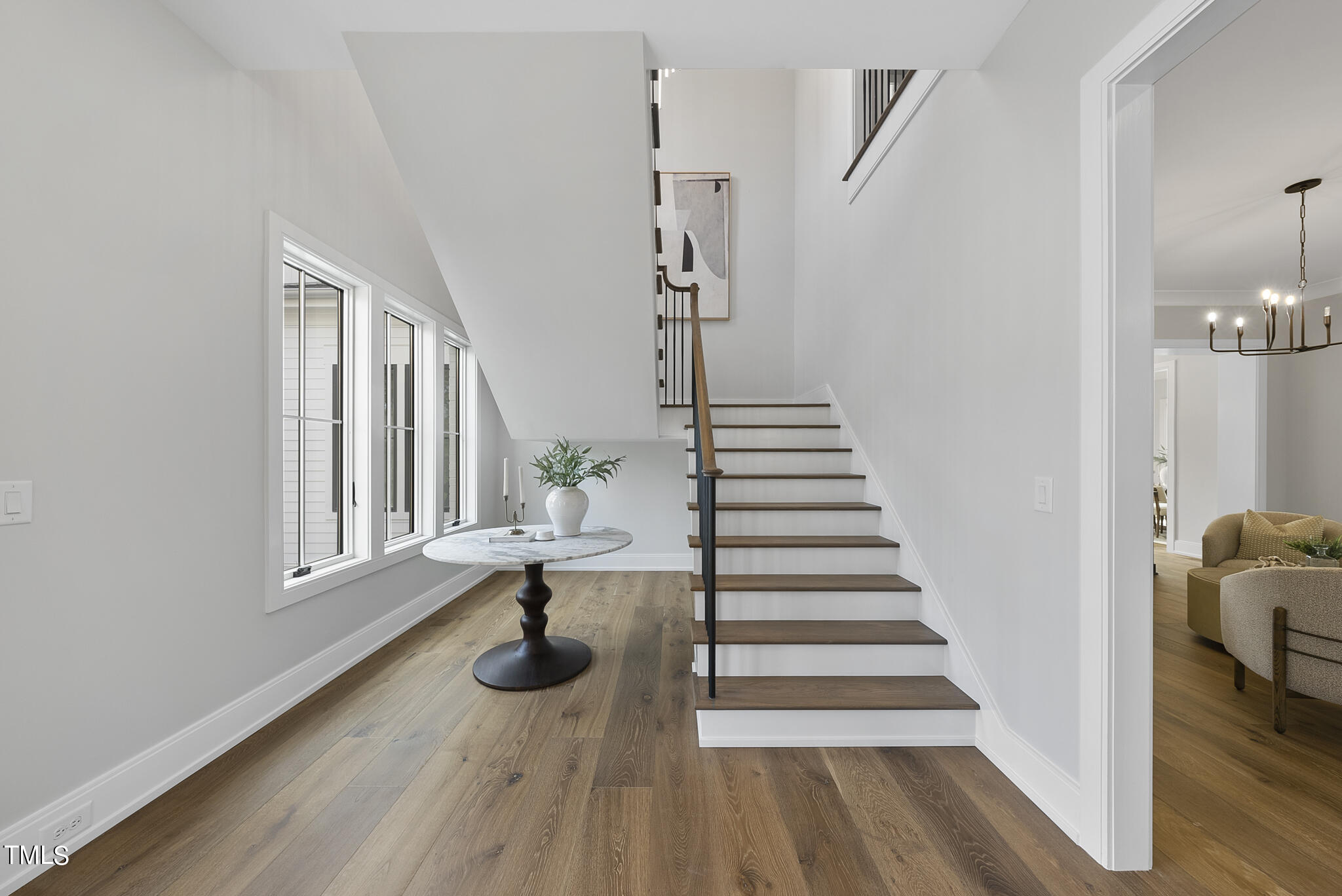3409 Makers Circle Raleigh, NC 27612 - Photo 6 of 100 a view of entryway and hall with wooden floor