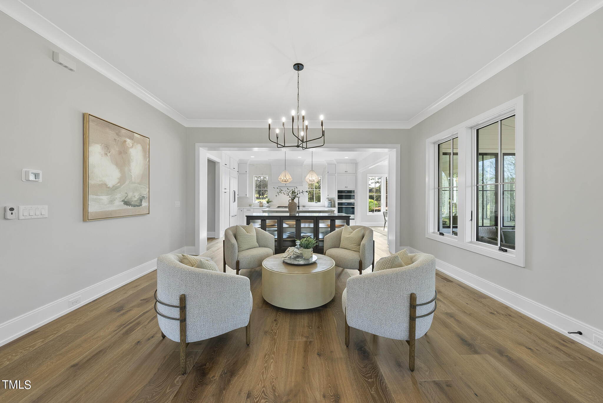 3409 Makers Circle Raleigh, NC 27612 - Photo 10 of 100 a view of a dining room with furniture a chandelier and wooden floor
