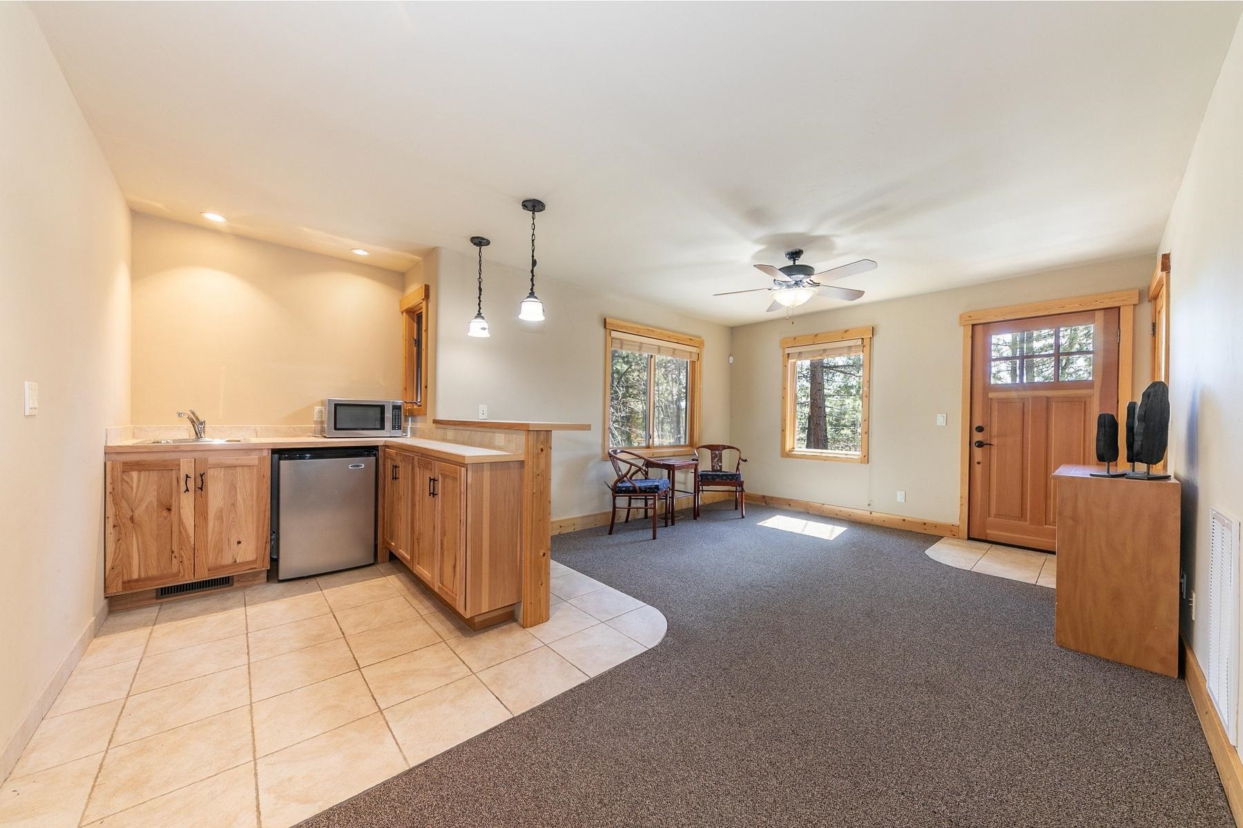 14070 Alder Creek Road Truckee, CA 96161 - Photo 18 of 28 a view of a kitchen with furniture and a window