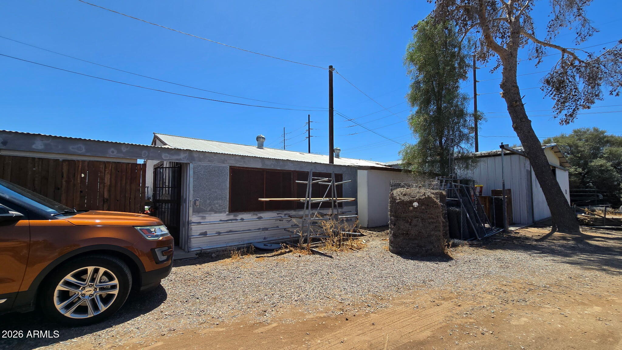 6803 South Miller Road Buckeye, AZ 85326 - Photo 23 of 50 a front view of a house with parking space