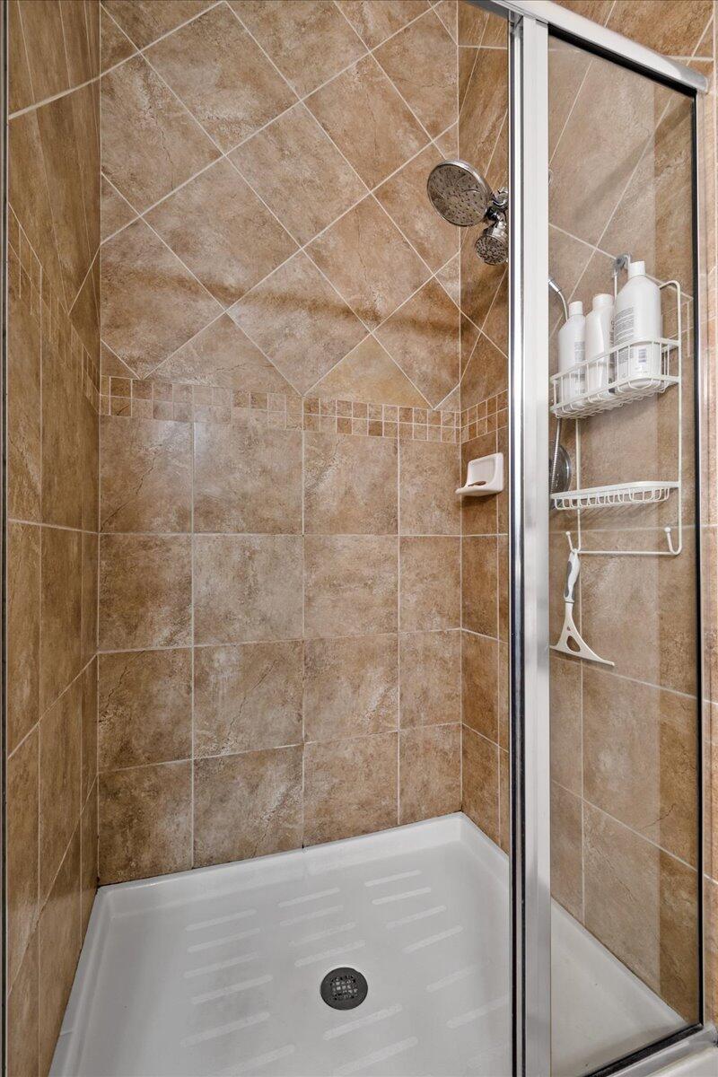 603 Dakota Drive Jupiter, FL 33458 - Photo 18 of 34 a bathroom with a shower