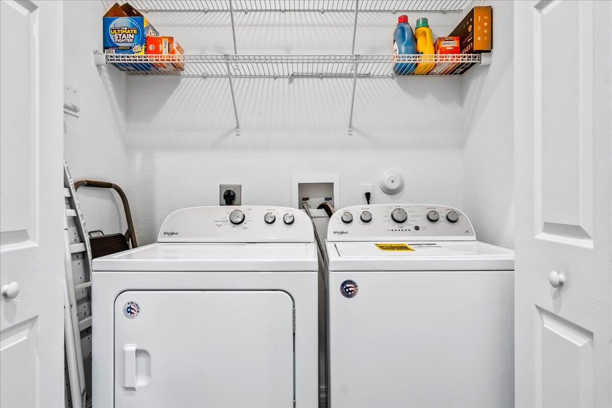 603 Dakota Drive Jupiter, FL 33458 - Photo 20 of 34 a utility room with dryer and washer