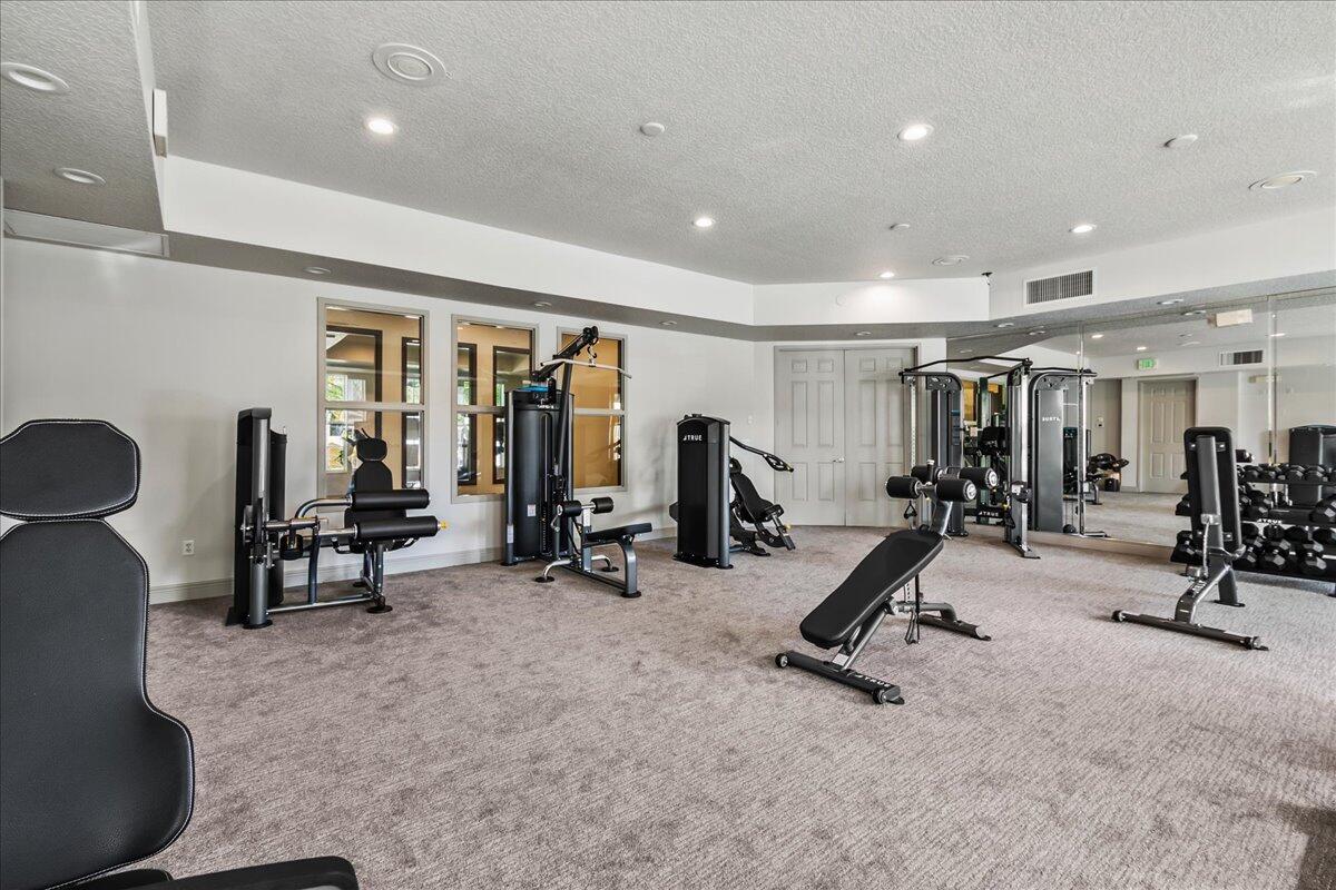 603 Dakota Drive Jupiter, FL 33458 - Photo 27 of 34 a view of a room with gym equipment