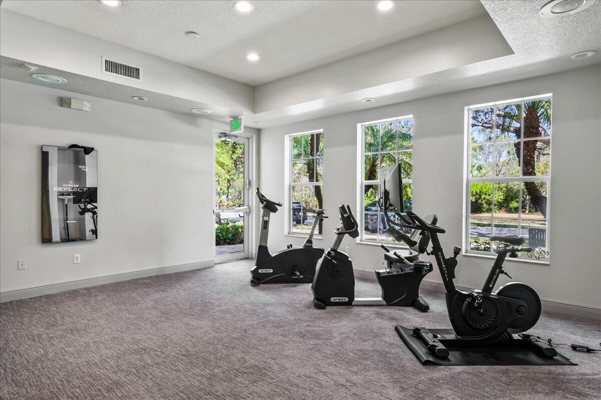 603 Dakota Drive Jupiter, FL 33458 - Photo 28 of 34 a view of a room with gym equipment