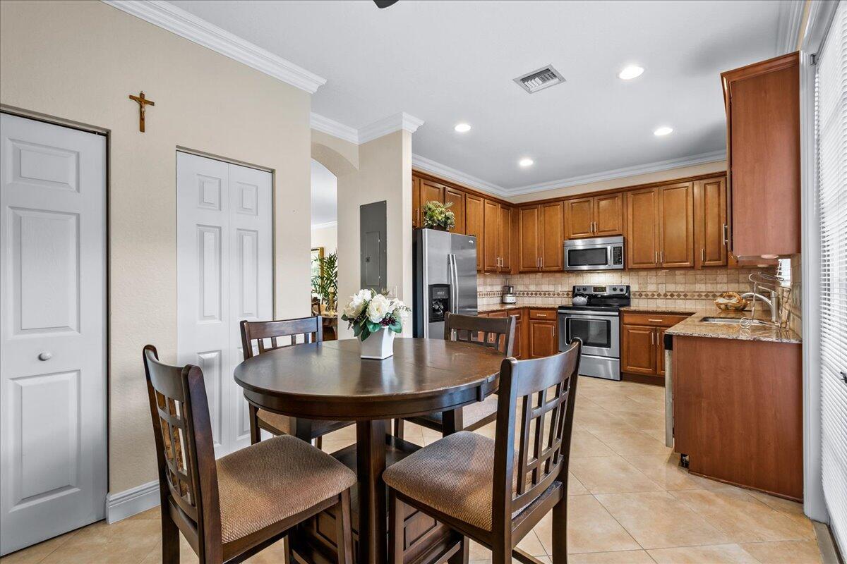 603 Dakota Drive Jupiter, FL 33458 - Photo 6 of 34 a view of a dining room with furniture