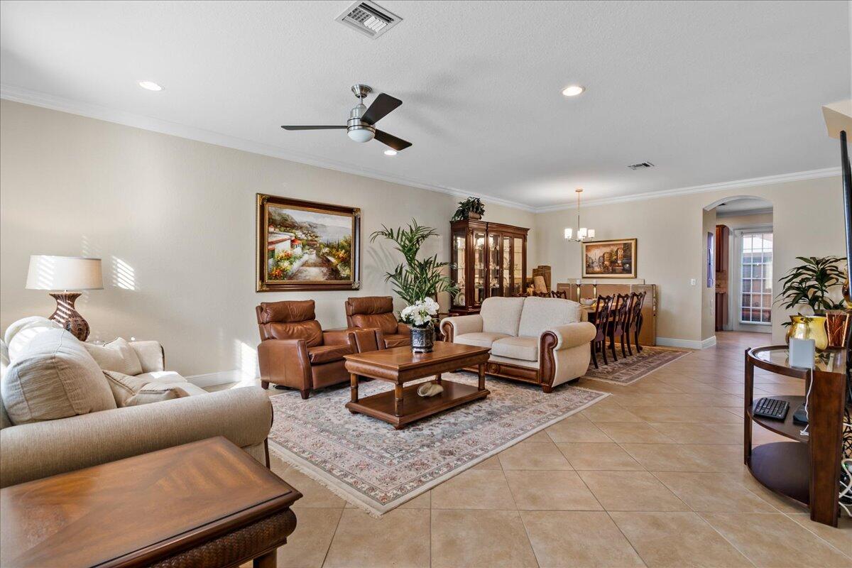 603 Dakota Drive Jupiter, FL 33458 - Photo 7 of 34 a living room with furniture and a wooden floor