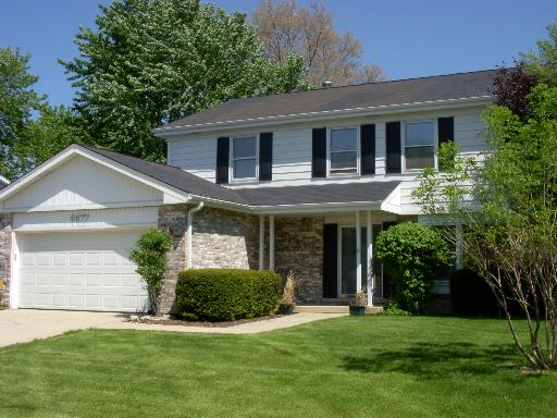 6677 Breckenridge Road Lisle, IL 60532 - Photo 1 of 1 a view of a house with a yard and potted plants