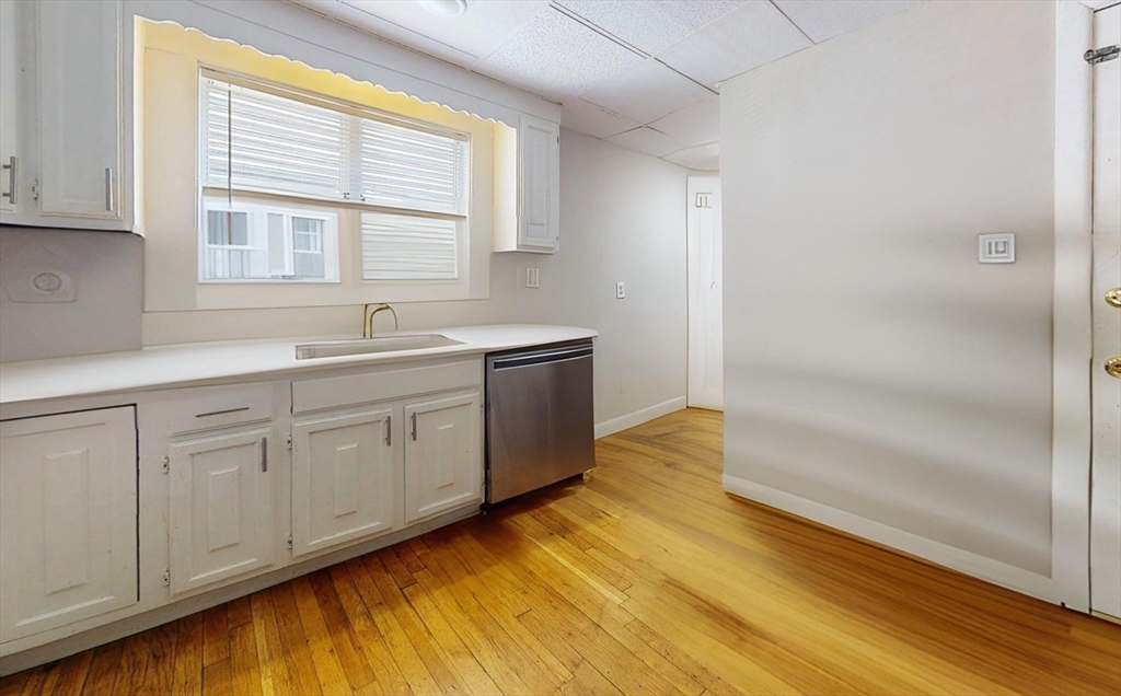 5 Edgar Terrace, Unit 1 Somerville, MA 02145 - Photo 1 of 10 a kitchen with a sink and cabinets