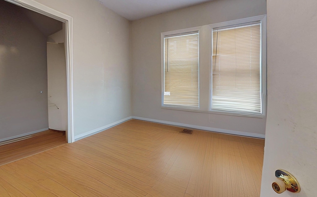 5 Edgar Terrace, Unit 1 Somerville, MA 02145 - Photo 4 of 10 a view of an empty room with a window