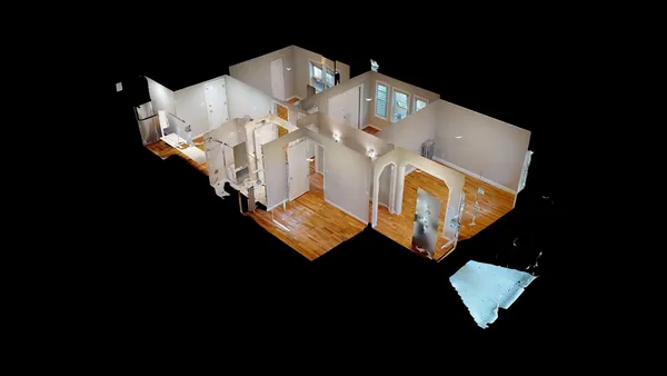 an aerial view of a house with a swimming pool patio and outdoor seating