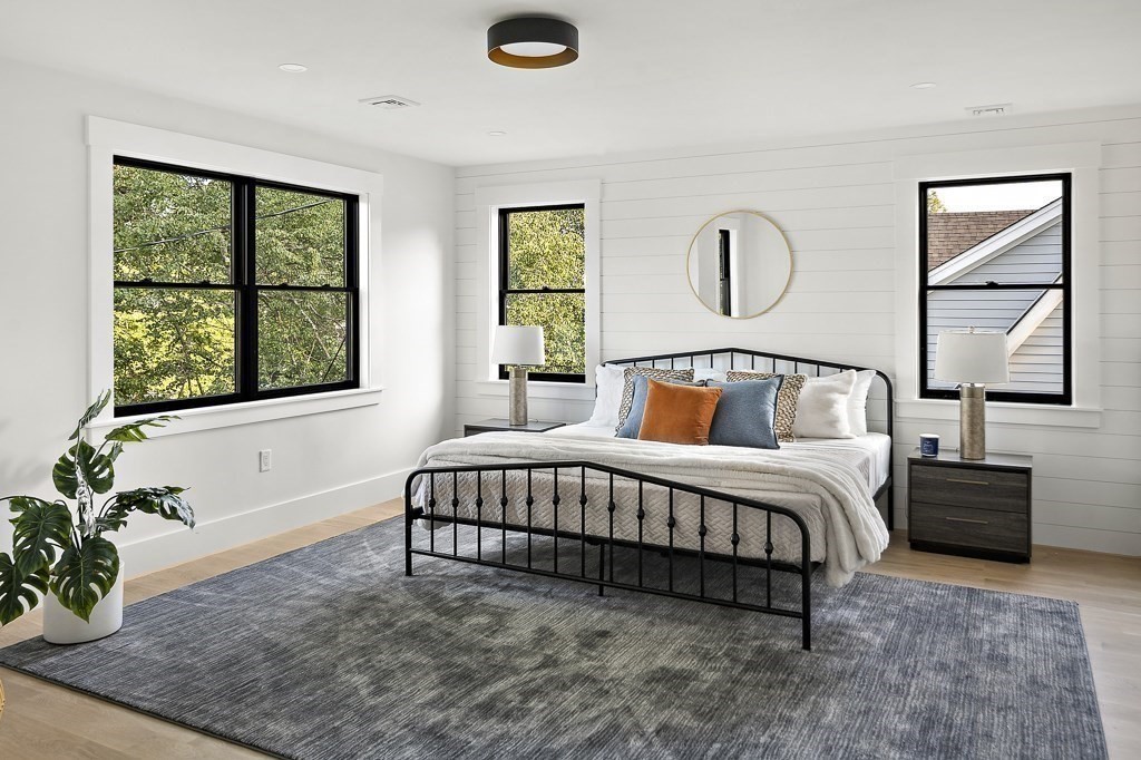 27 Coolidge Avenue Needham, MA 02492 - Photo 18 of 39 a bedroom with a bed lamp and window