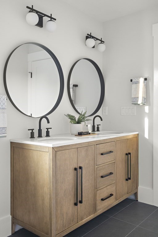 27 Coolidge Avenue Needham, MA 02492 - Photo 24 of 39 a bathroom with 2 sink and a mirror