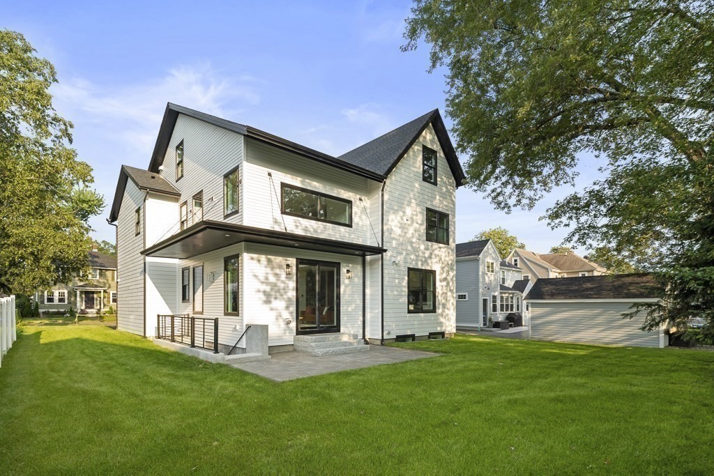 27 Coolidge Avenue Needham, MA 02492 - Photo 39 of 39 a front view of a house with a yard