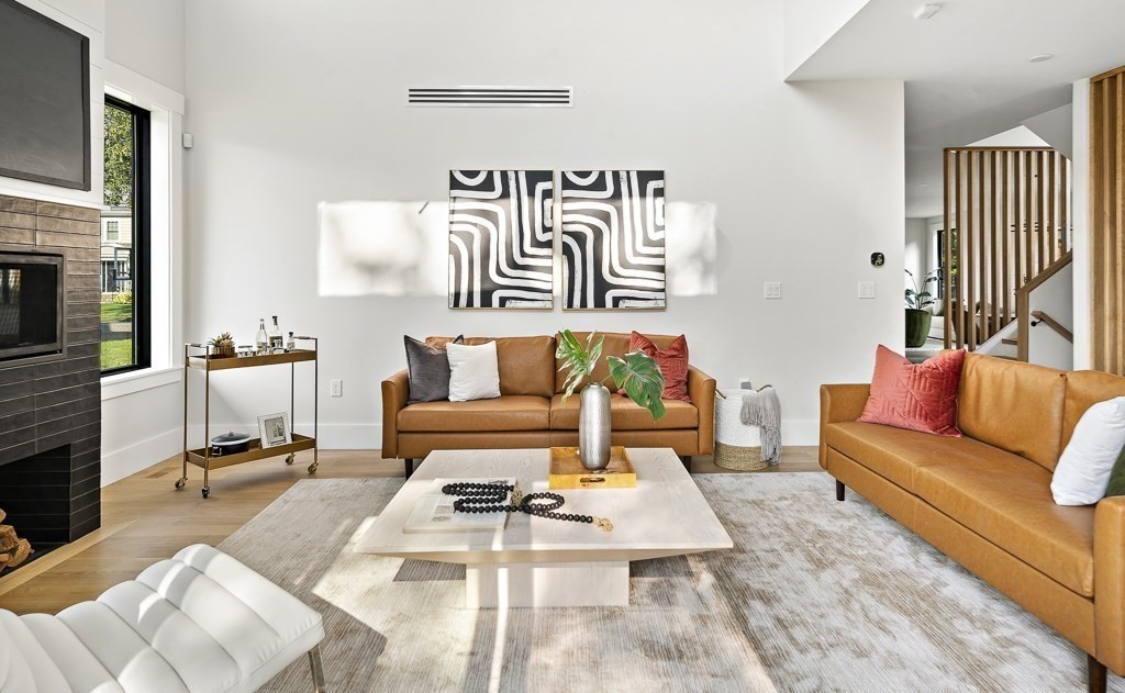 27 Coolidge Avenue Needham, MA 02492 - Photo 7 of 39 a living room with furniture and a flat screen tv