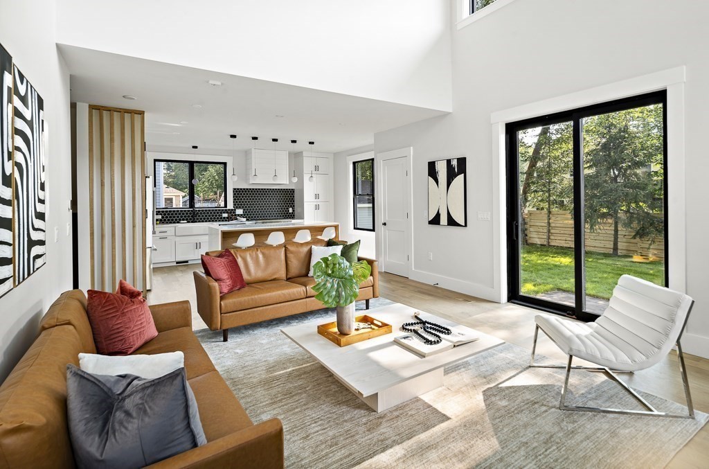 27 Coolidge Avenue Needham, MA 02492 - Photo 8 of 39 a living room with furniture and a large window