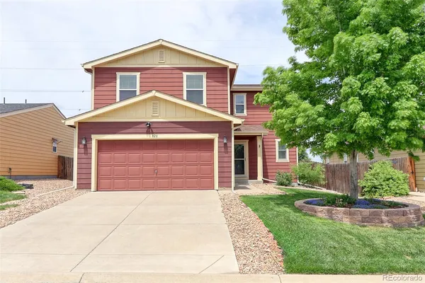 a front view of a house with yard