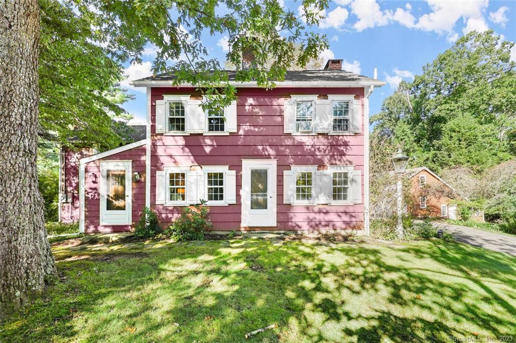 1083 Ridgefield Road Wilton, CT 06897 - Photo 1 of 1 front view of house with a yard