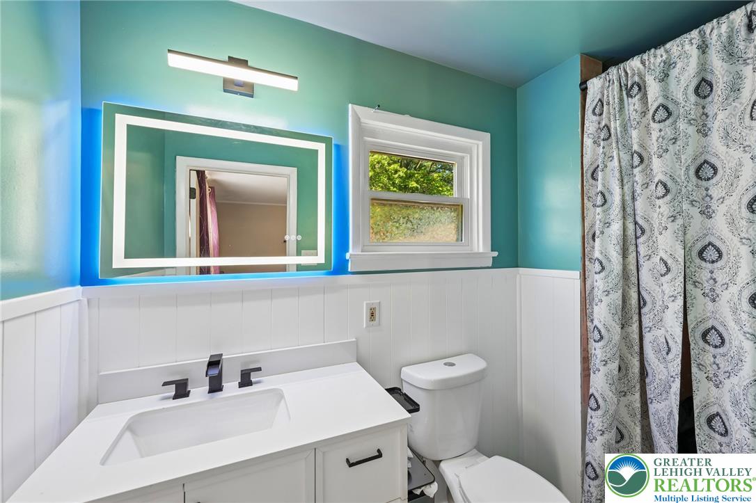 2649 Nottingham Road Bethlehem, PA 18017 - Photo 25 of 49 A well-appointed bathroom features a modern vanity with a sleek faucet and an illuminated mirror.