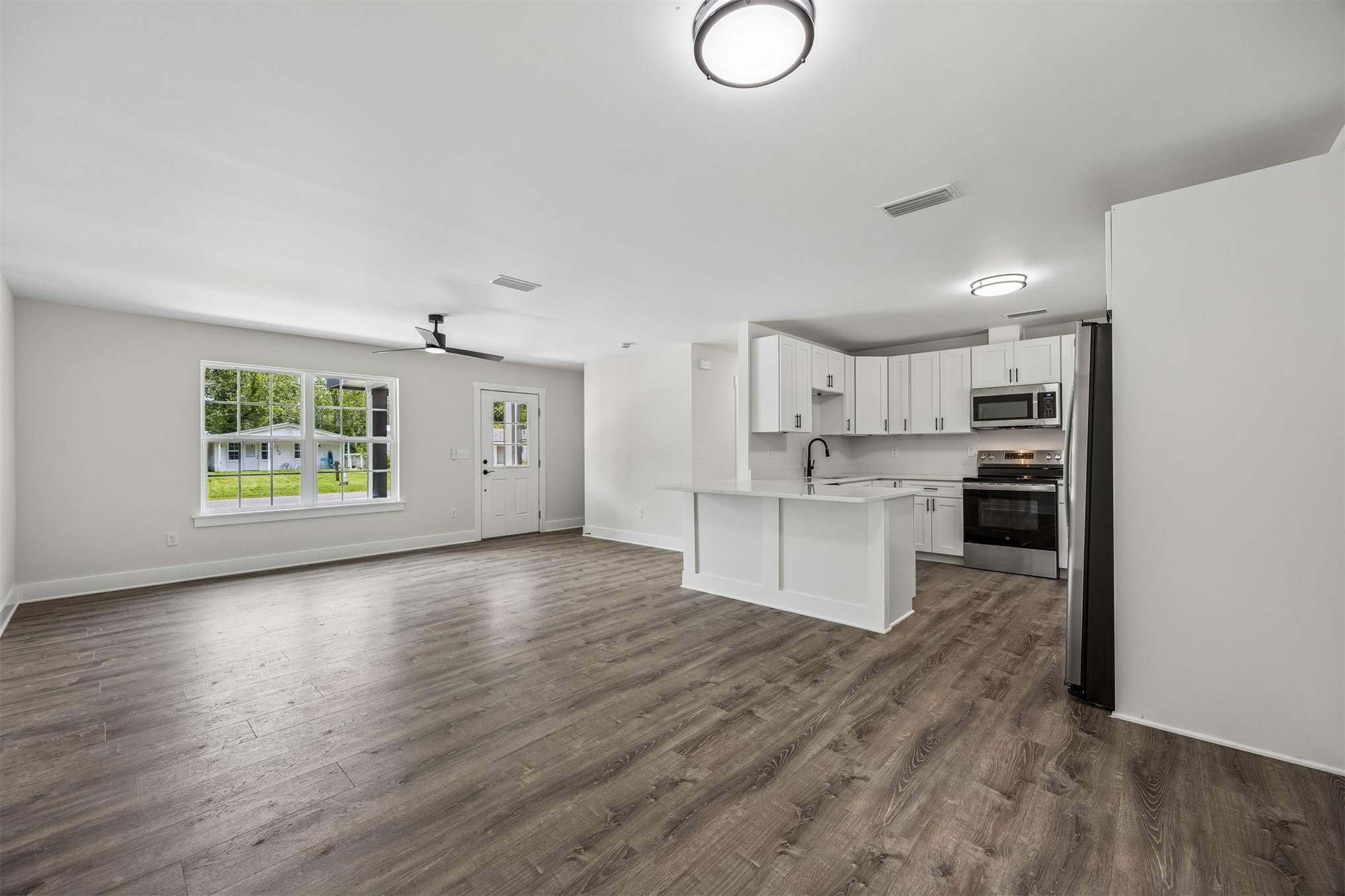 552 Sunset Road Fernandina Beach, FL 32034 - Photo 5 of 23 a view of kitchen with cabinets and wooden floor