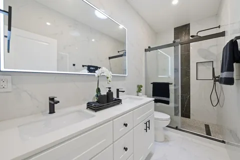 a kitchen with a refrigerator and a sink