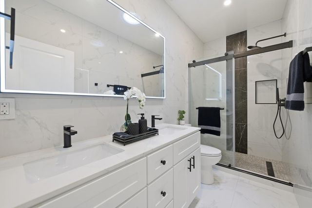 a kitchen with a refrigerator and a sink