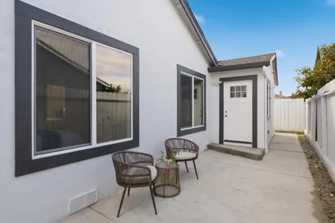 a view of an outdoor space with a door and windows