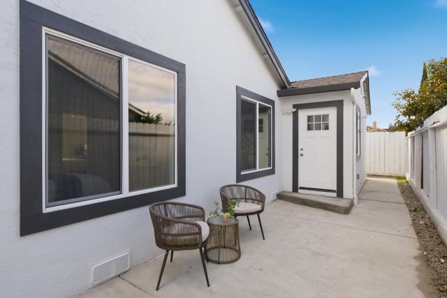 a view of an outdoor space with a door and windows