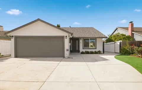 a front view of house with garage and yard