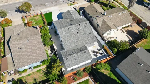 an aerial view of a house with outdoor space