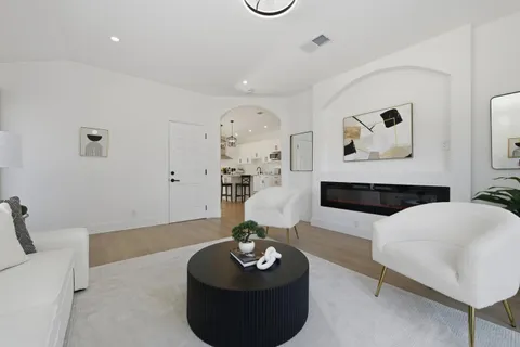 a living room with furniture and a table