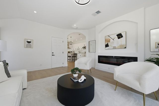 a living room with furniture and a table