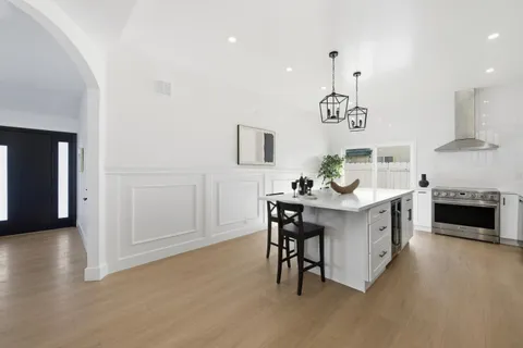 a kitchen with a sink cabinets and window